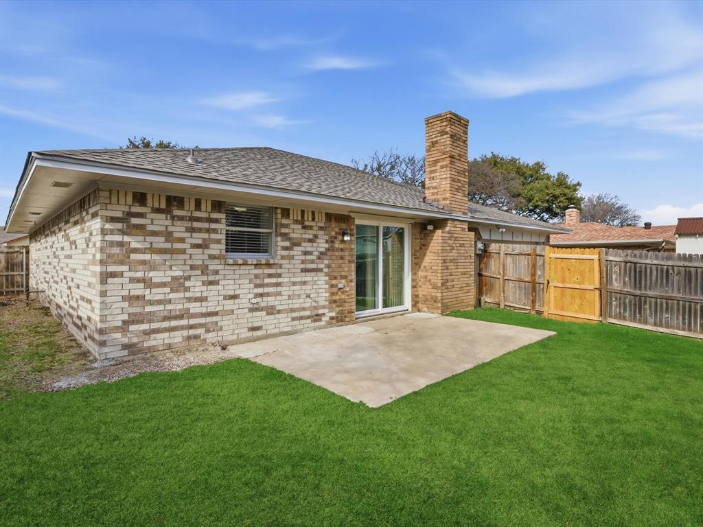 625 Reno Street Lewisville, TX 75077 - Photo 23 of 25 a front view of a house with garden