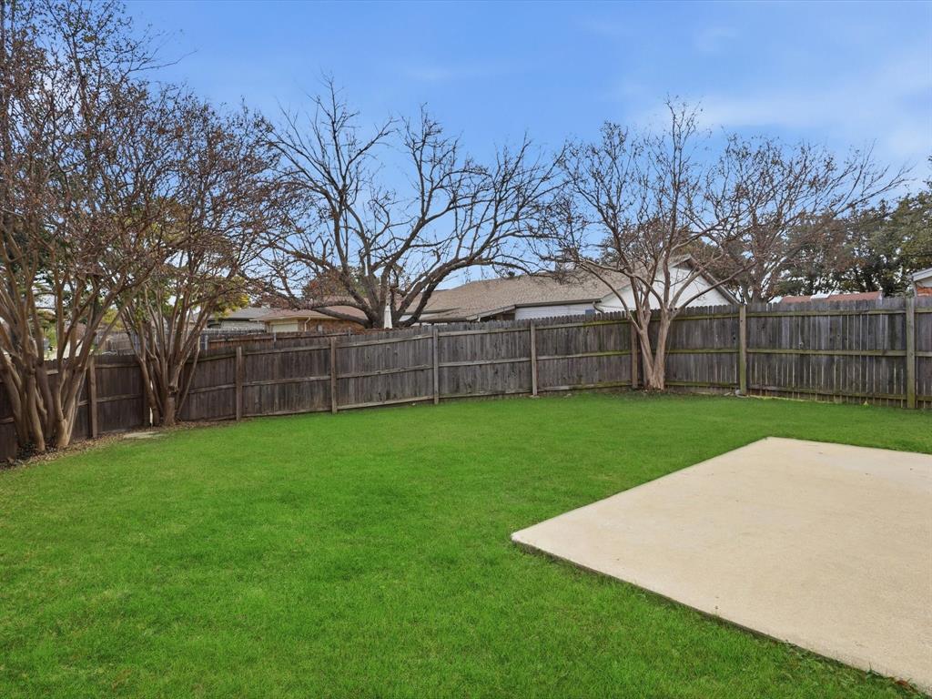 625 Reno Street Lewisville, TX 75077 - Photo 25 of 25 a view of a backyard with green space