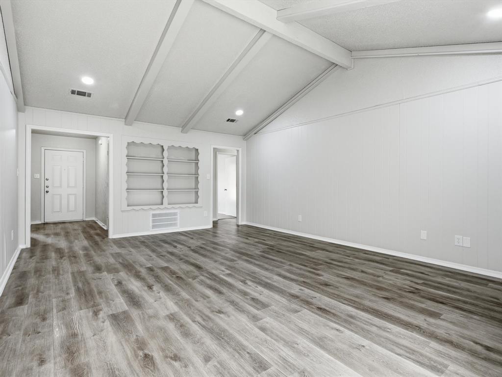 625 Reno Street Lewisville, TX 75077 - Photo 10 of 25 wooden floor in an empty room with a window