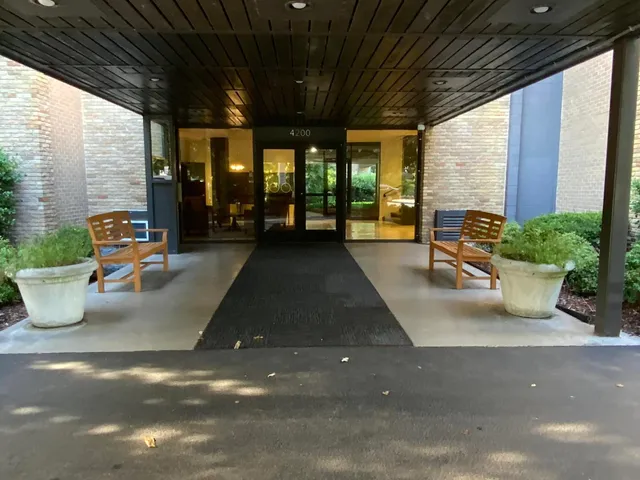 a lobby with chair and window