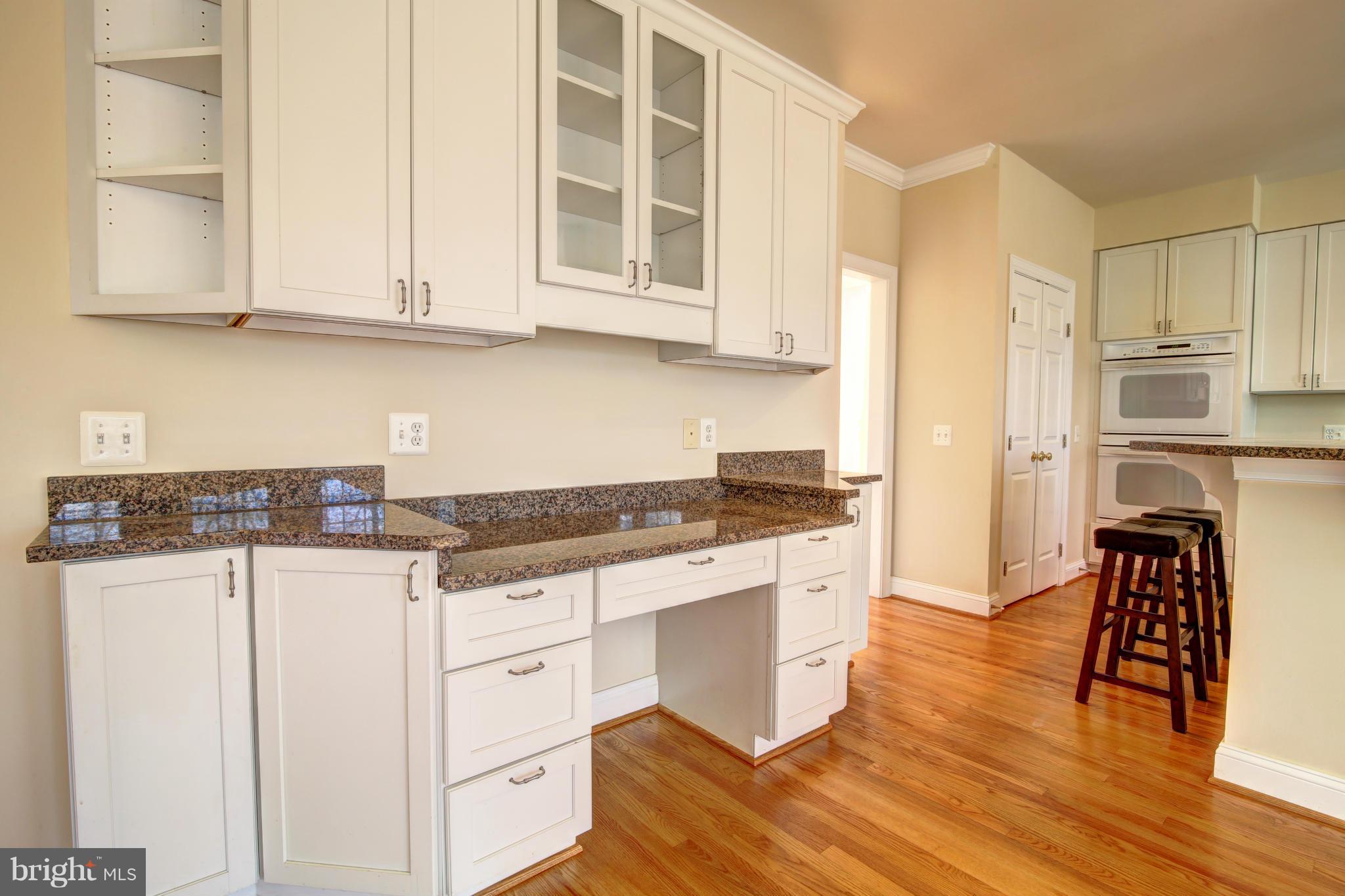 38990 Lime Kiln Road Leesburg, VA 20175 - Photo 11 of 30 a kitchen with stainless steel appliances granite countertop a stove a sink and a refrigerator with white cabinets
