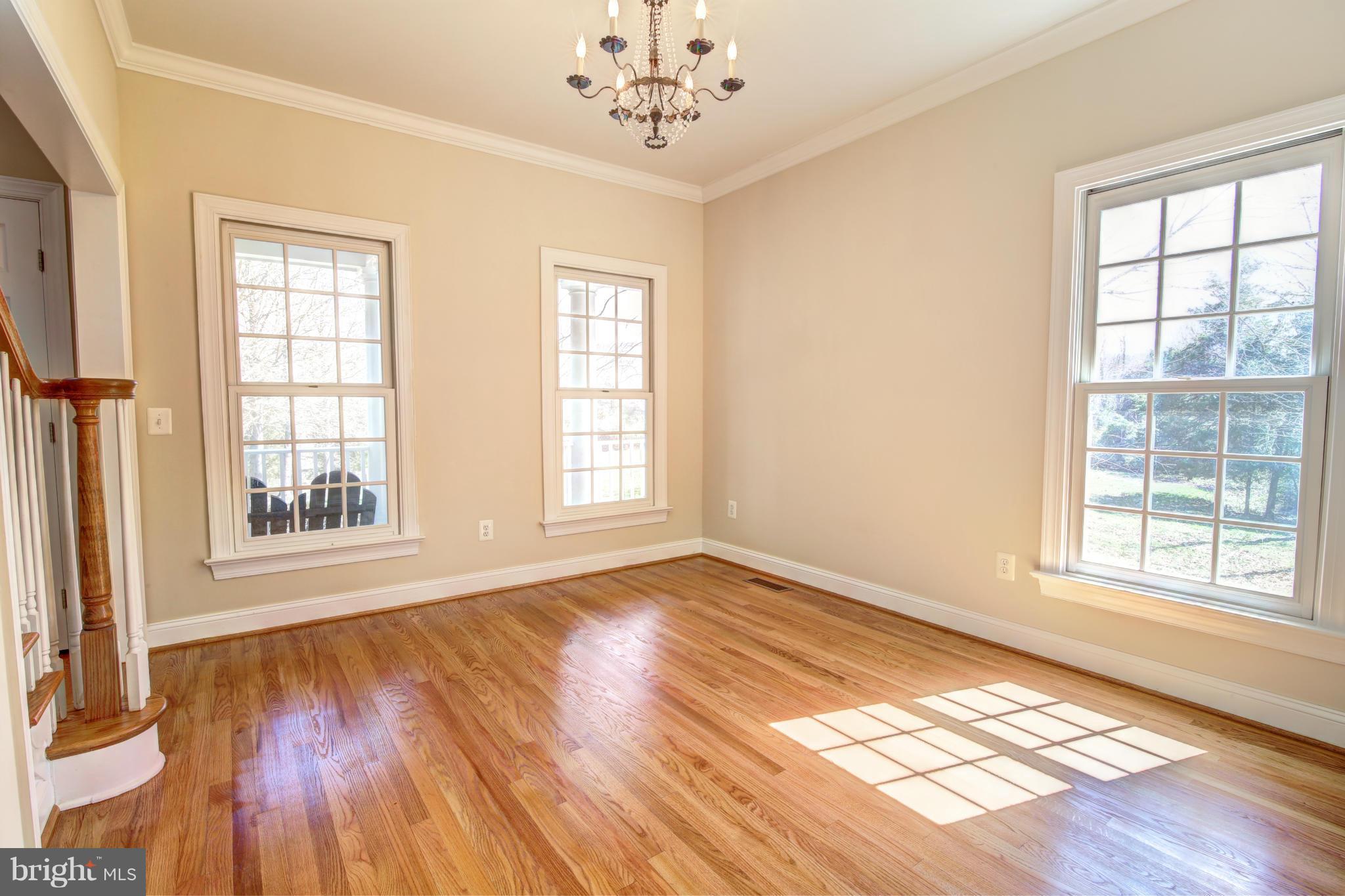 38990 Lime Kiln Road Leesburg, VA 20175 - Photo 13 of 30 an empty room with wooden floor and windows