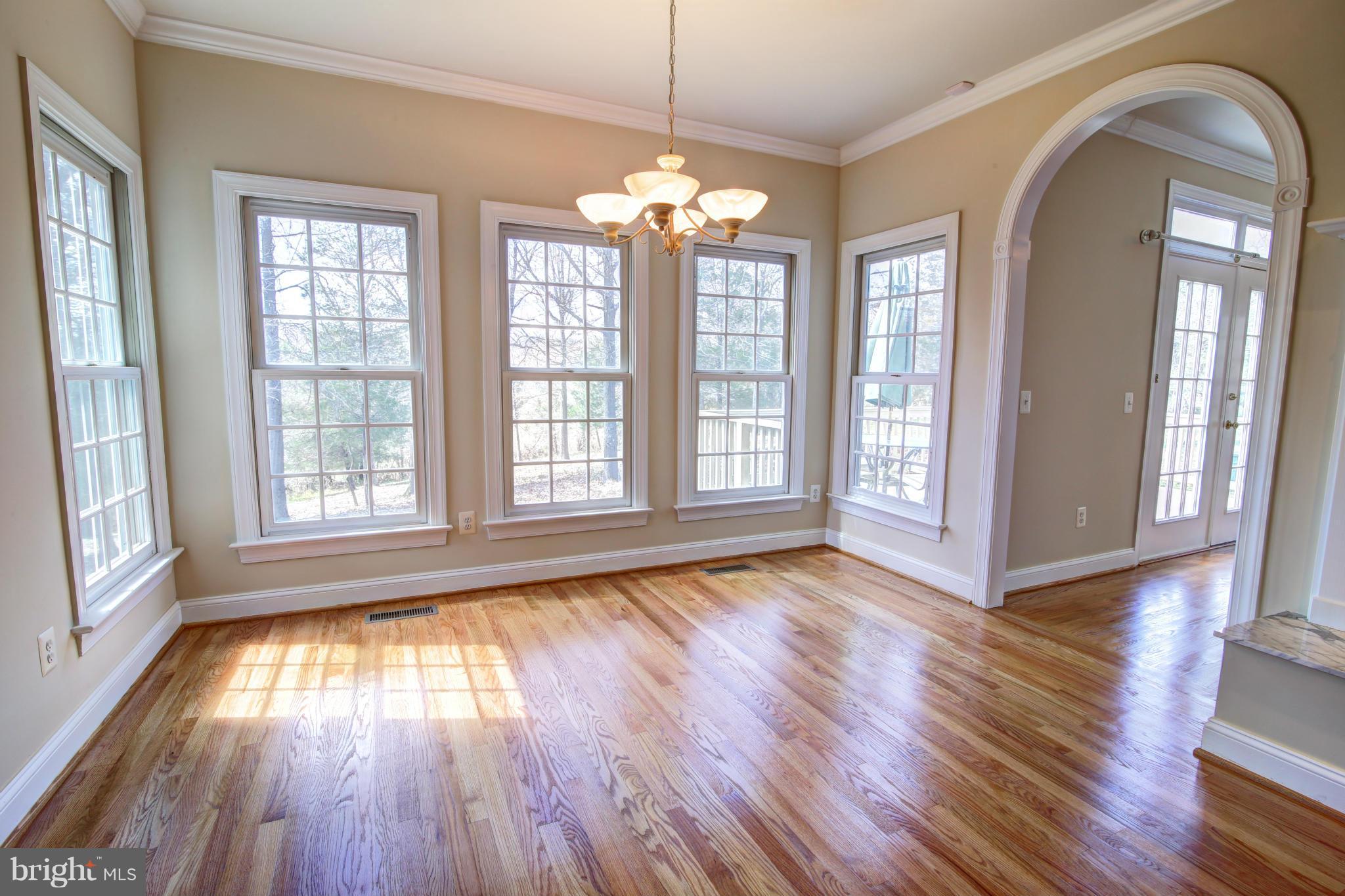 38990 Lime Kiln Road Leesburg, VA 20175 - Photo 14 of 30 a view of empty room with wooden floor and fan