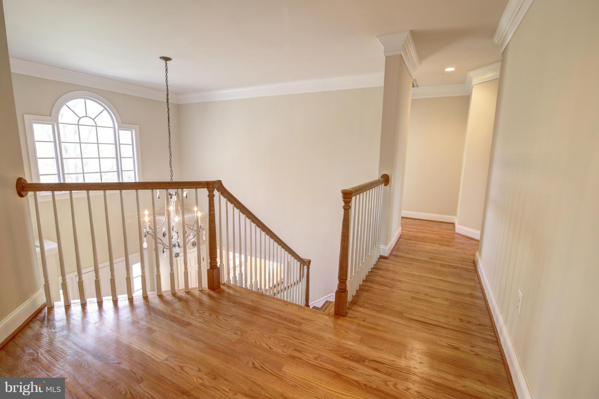 38990 Lime Kiln Road Leesburg, VA 20175 - Photo 18 of 30 a view of a hallway with wooden floor and entryway