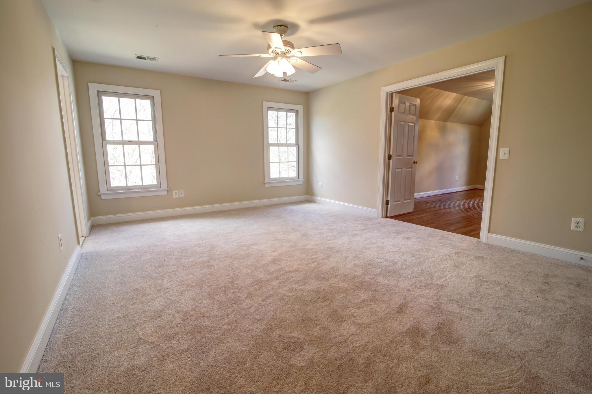 38990 Lime Kiln Road Leesburg, VA 20175 - Photo 20 of 30 an empty room with windows and fan