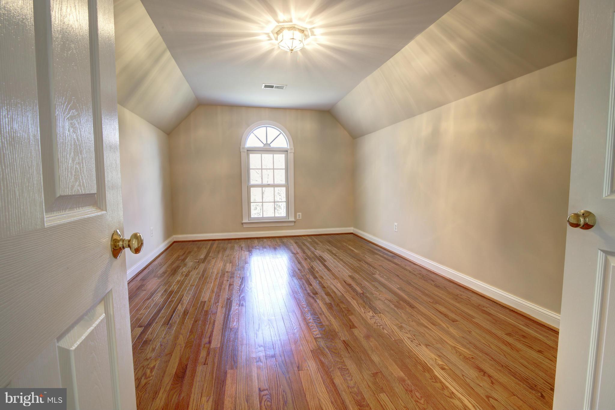 38990 Lime Kiln Road Leesburg, VA 20175 - Photo 21 of 30 wooden floor in an empty room with a window