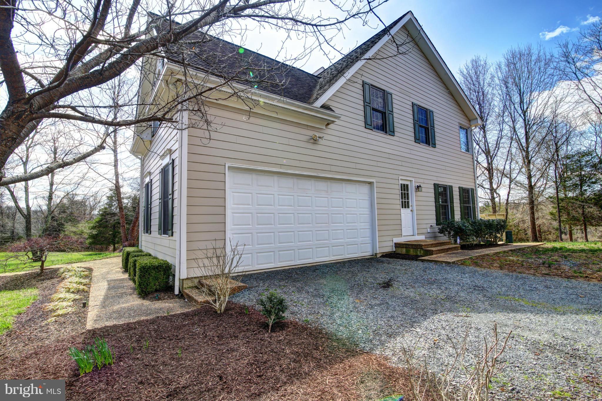 38990 Lime Kiln Road Leesburg, VA 20175 - Photo 28 of 30 a view of a house with a yard and garage