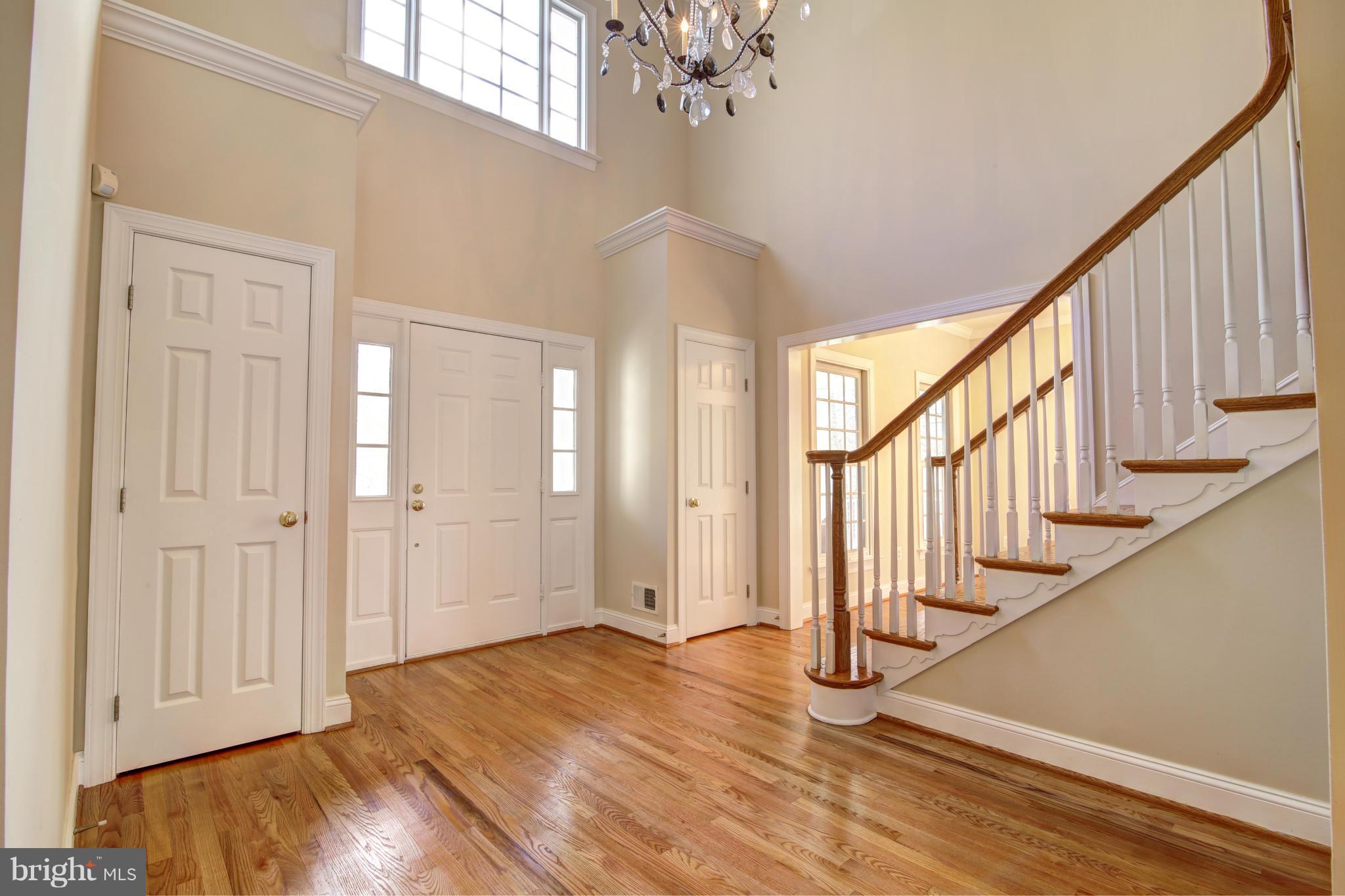 38990 Lime Kiln Road Leesburg, VA 20175 - Photo 6 of 30 a view of an entryway with wooden floor and stairs