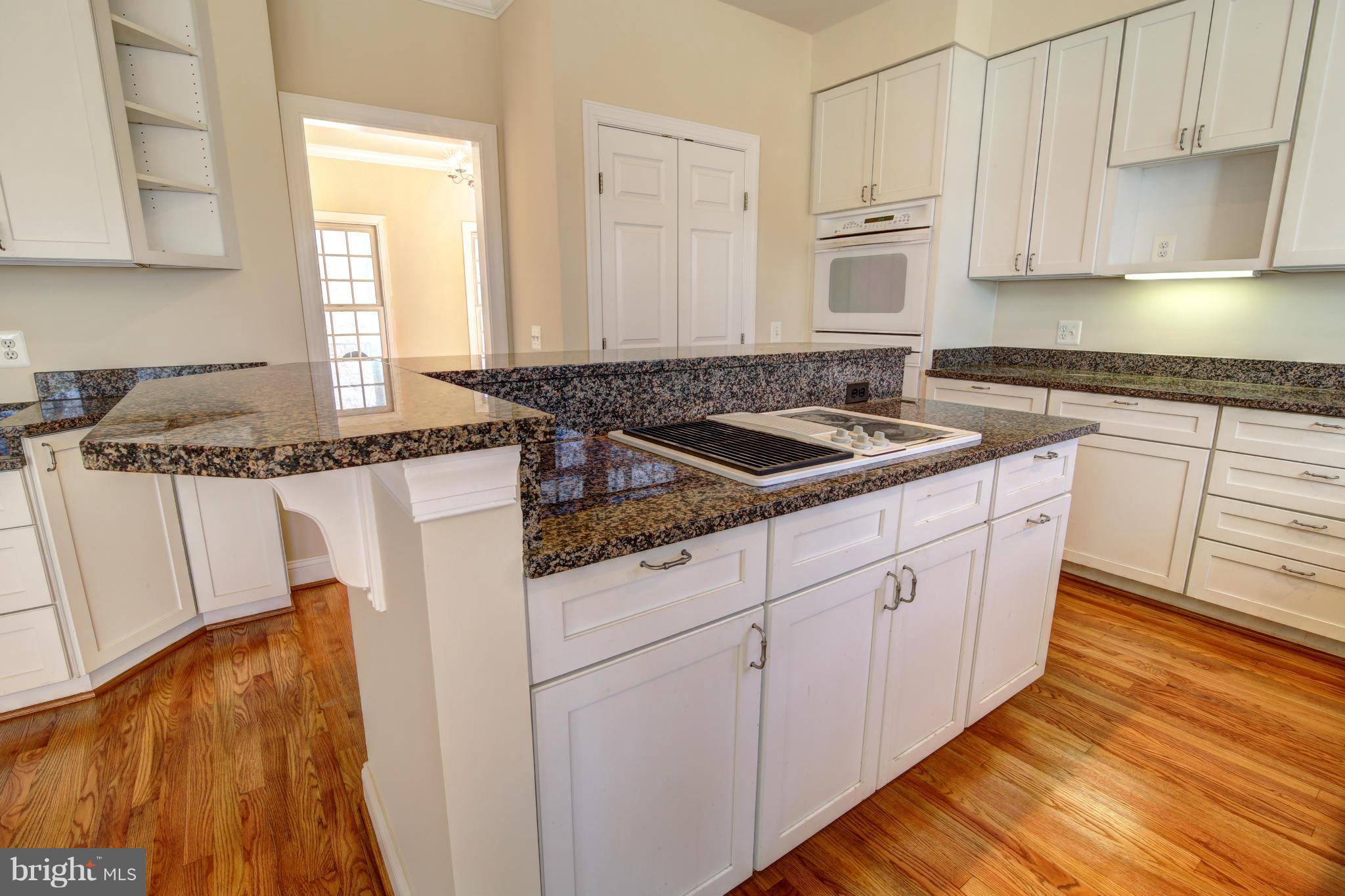 38990 Lime Kiln Road Leesburg, VA 20175 - Photo 8 of 30 a kitchen with stainless steel appliances granite countertop a sink stove and cabinets