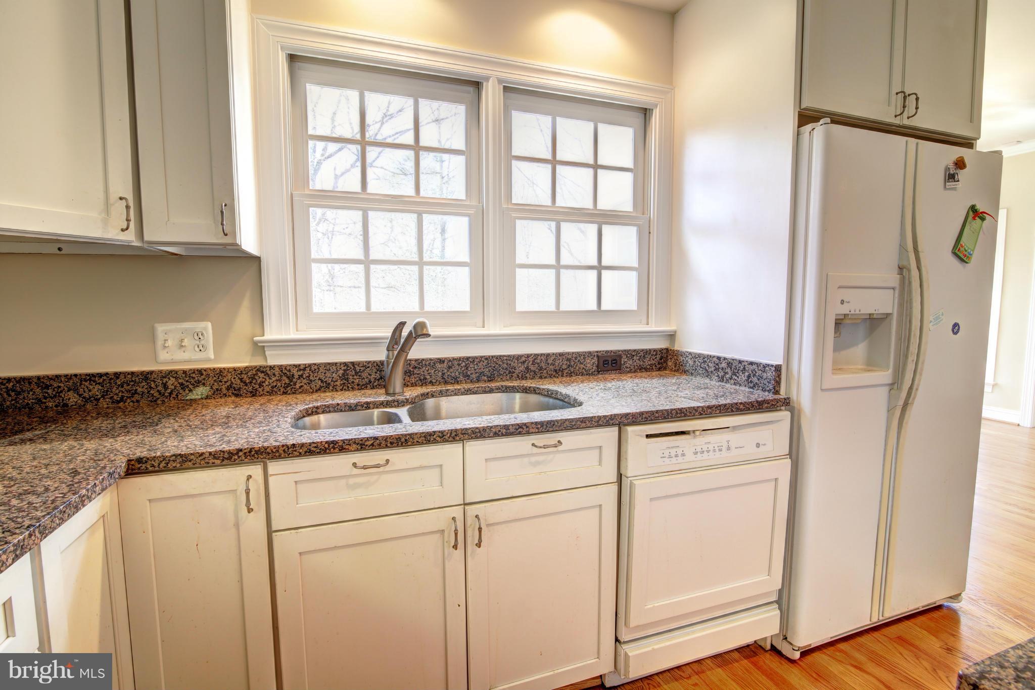 38990 Lime Kiln Road Leesburg, VA 20175 - Photo 10 of 30 a kitchen with granite countertop white cabinets and a sink