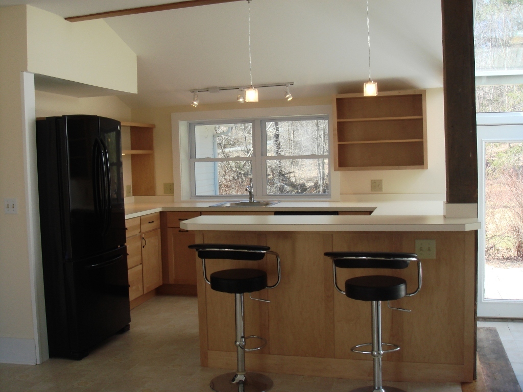 523 Hancock Road Williamstown, MA 01267 - Photo 2 of 16 a kitchen with stainless steel appliances granite countertop a sink and a refrigerator