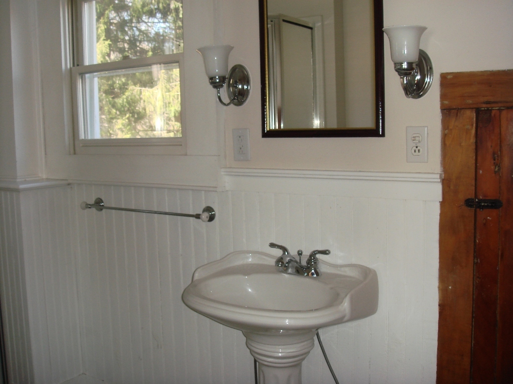 523 Hancock Road Williamstown, MA 01267 - Photo 12 of 16 a bathroom with a sink a mirror and window