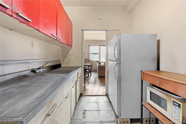 a kitchen with a sink stove and refrigerator