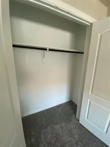 a bathroom with a toilet a sink and a window