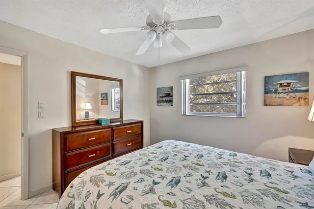 a room with furniture pool table and flat screen tv