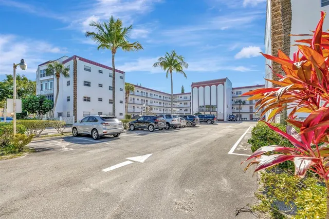 a view of yard with swimming pool and green space