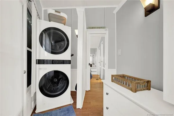 a view of a hallway with washer and dryer