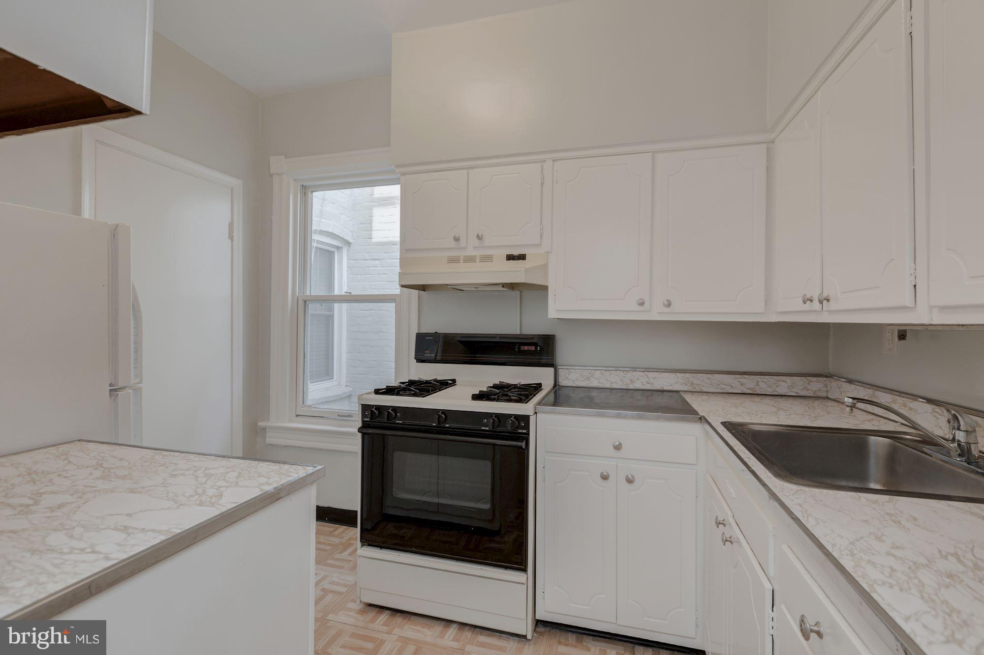 3044 R Street Northwest, Unit 2 Washington, DC 20007 - Photo 7 of 26 Kitchen With Gas Stove