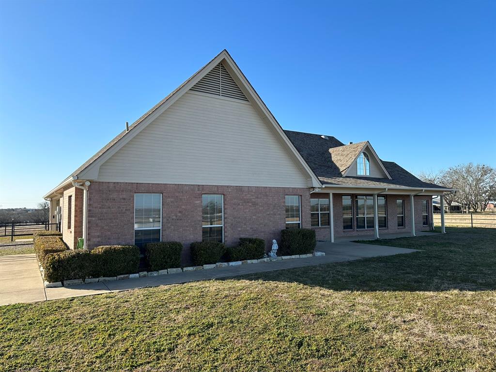 8324-c R 1006 C R 1006 Godley, TX 76044 - Photo 21 of 23 a front view of a house with a yard