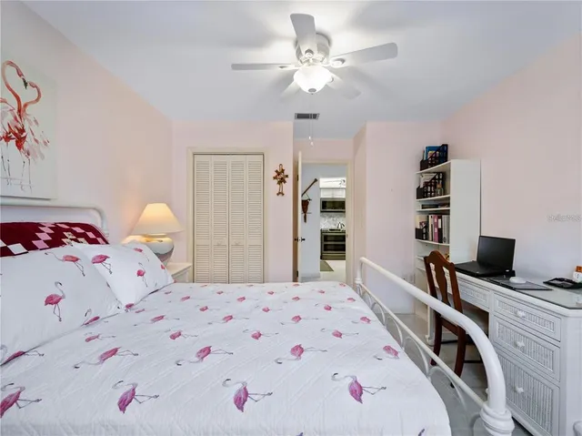 a bedroom with a bed and a dresser