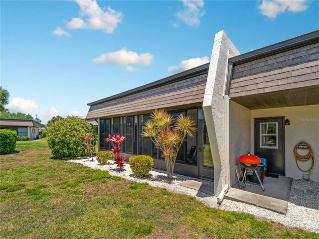 a front view of a house with parking space