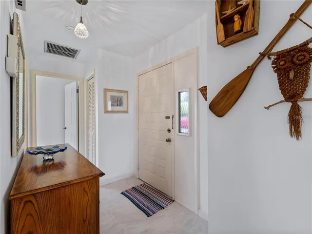 a kitchen with stainless steel appliances granite countertop a refrigerator a sink a stove a microwave and island