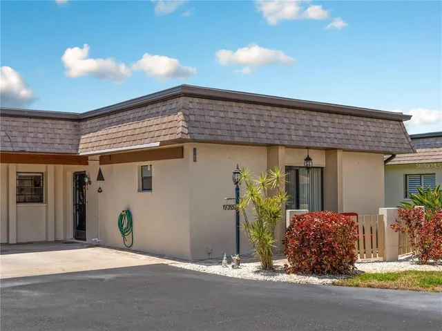 a backyard of a house with garden
