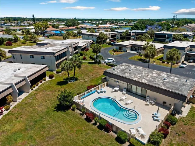 an aerial view of a house with garden space and houses view