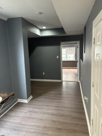 a view of a livingroom with wooden floor