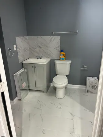 a bathroom with a toilet and a sink