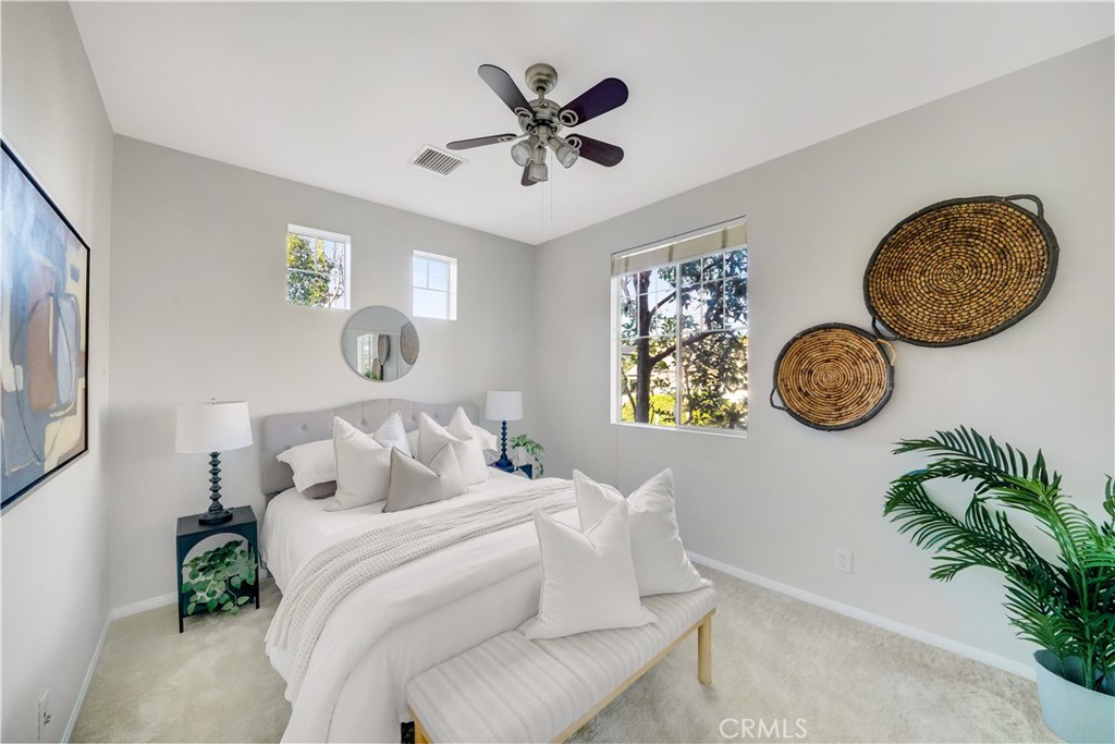 6 Chadron Circle Ladera Ranch, CA 92694 - Photo 20 of 45 a bedroom with a bed mirror and a window