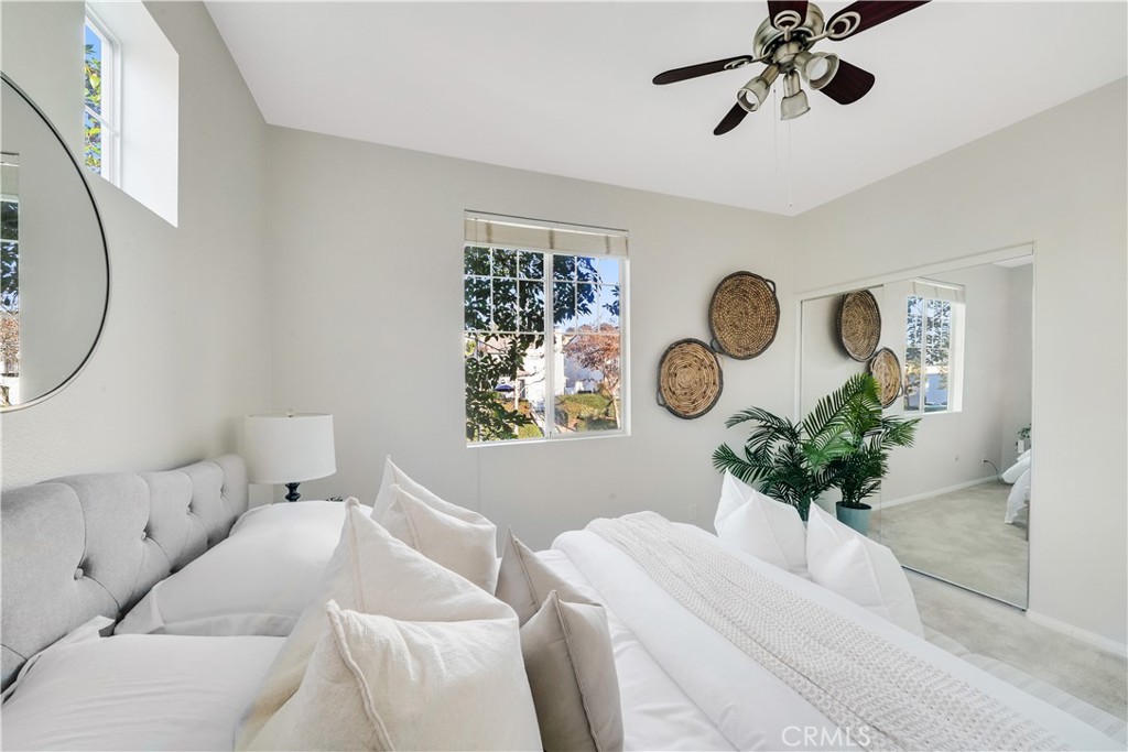 6 Chadron Circle Ladera Ranch, CA 92694 - Photo 21 of 45 a bedroom with a bed and a chandelier
