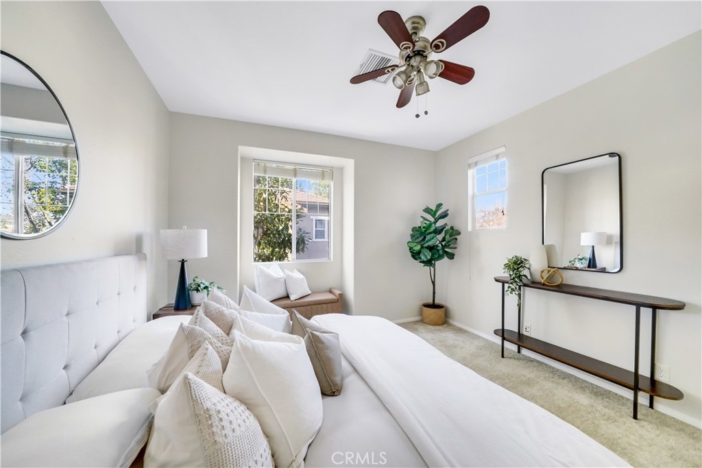 6 Chadron Circle Ladera Ranch, CA 92694 - Photo 24 of 45 a bedroom with a bed a chandelier and a window