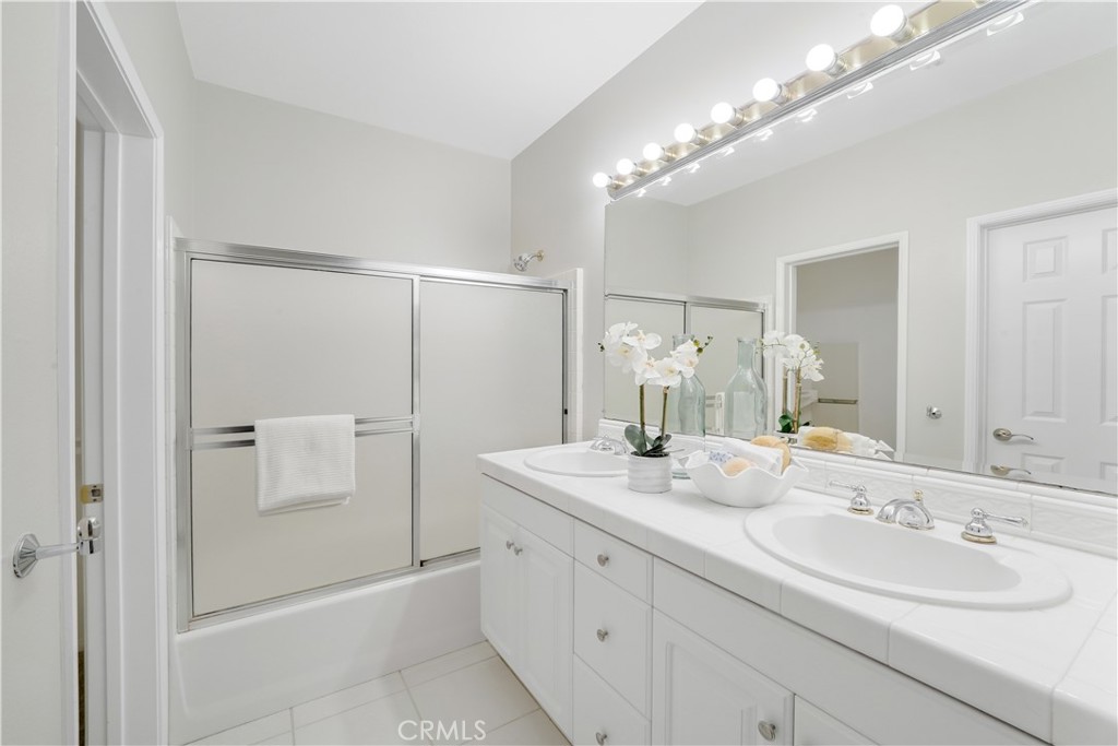 6 Chadron Circle Ladera Ranch, CA 92694 - Photo 25 of 45 a bathroom with a double vanity sink mirror and shower