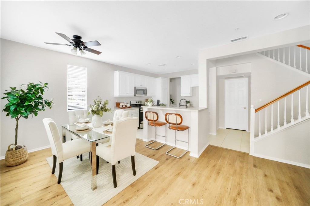 6 Chadron Circle Ladera Ranch, CA 92694 - Photo 7 of 45 a view of a dining room with furniture and a potted plant