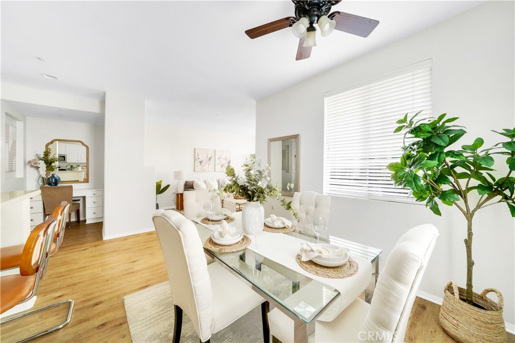 6 Chadron Circle Ladera Ranch, CA 92694 - Photo 10 of 45 a dining room with furniture potted plants and wooden floor