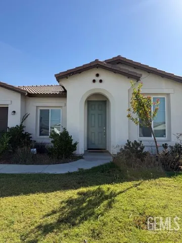 a front view of a house with swimming pool