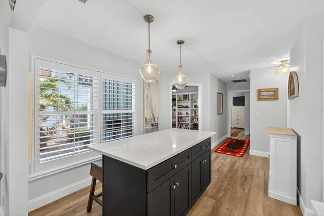a kitchen with a sink cabinets and window