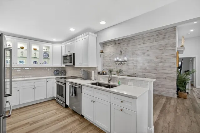 a spacious bedroom with a bed and a couch