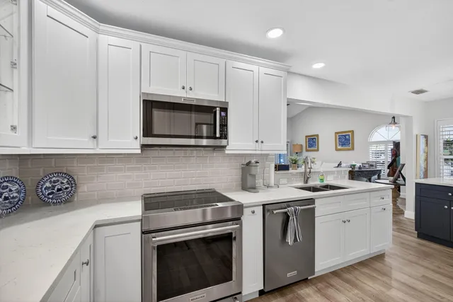 a spacious bathroom with a sink a mirror a vanity and a shower