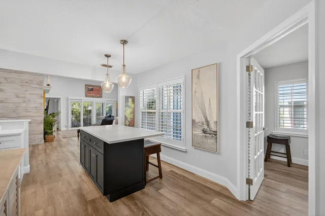 a bathroom with a granite countertop sink mirror toilet and bathtub