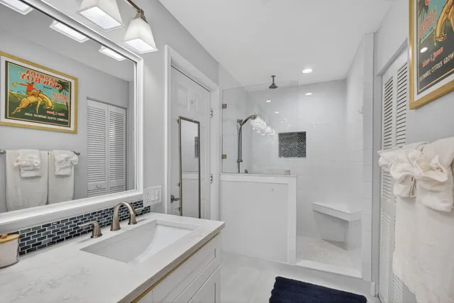 a view of a patio with couches table and chairs and potted plants