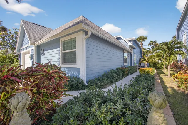a view of a house with a flower garden