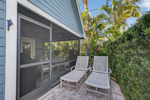 an aerial view of a houses with yard