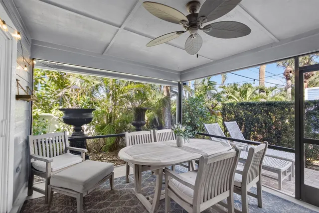 a kitchen with table chairs cabinets and stainless steel appliances