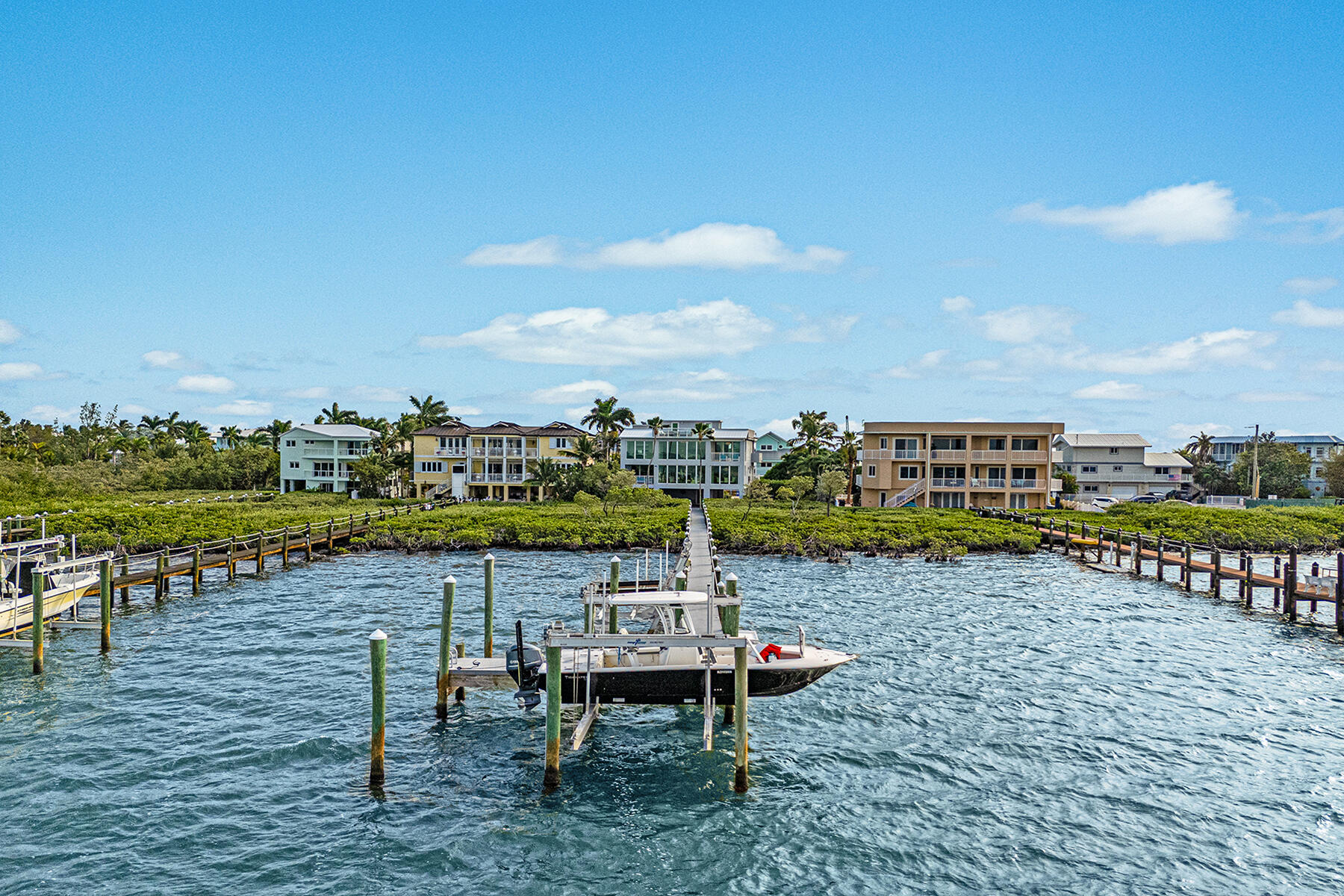 108 North Bounty Lane Key Largo, FL 33037 - Photo 37 of 79 a view of a lake with table and chairs