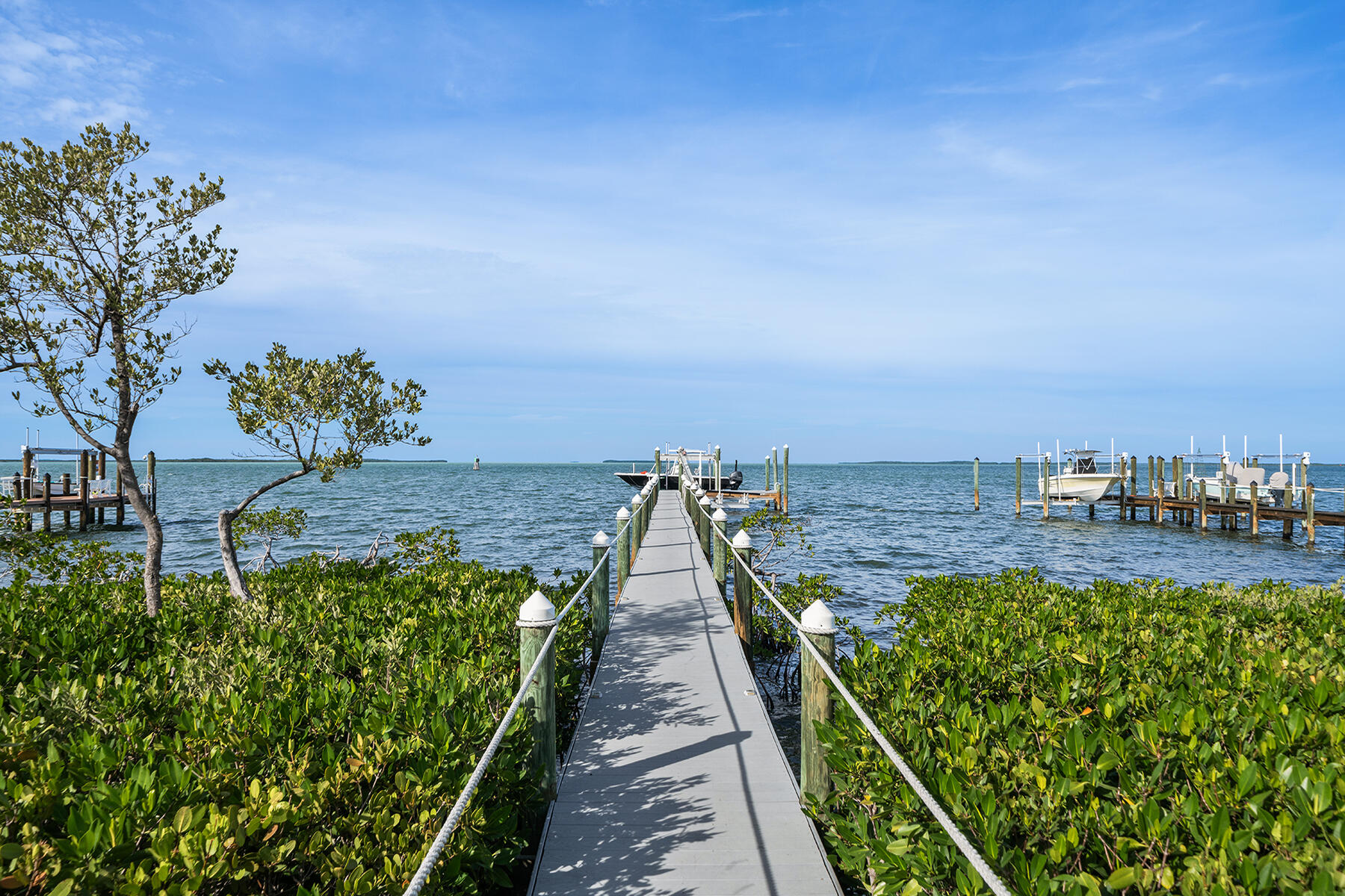 108 North Bounty Lane Key Largo, FL 33037 - Photo 4 of 79 a view of a lake with a garden