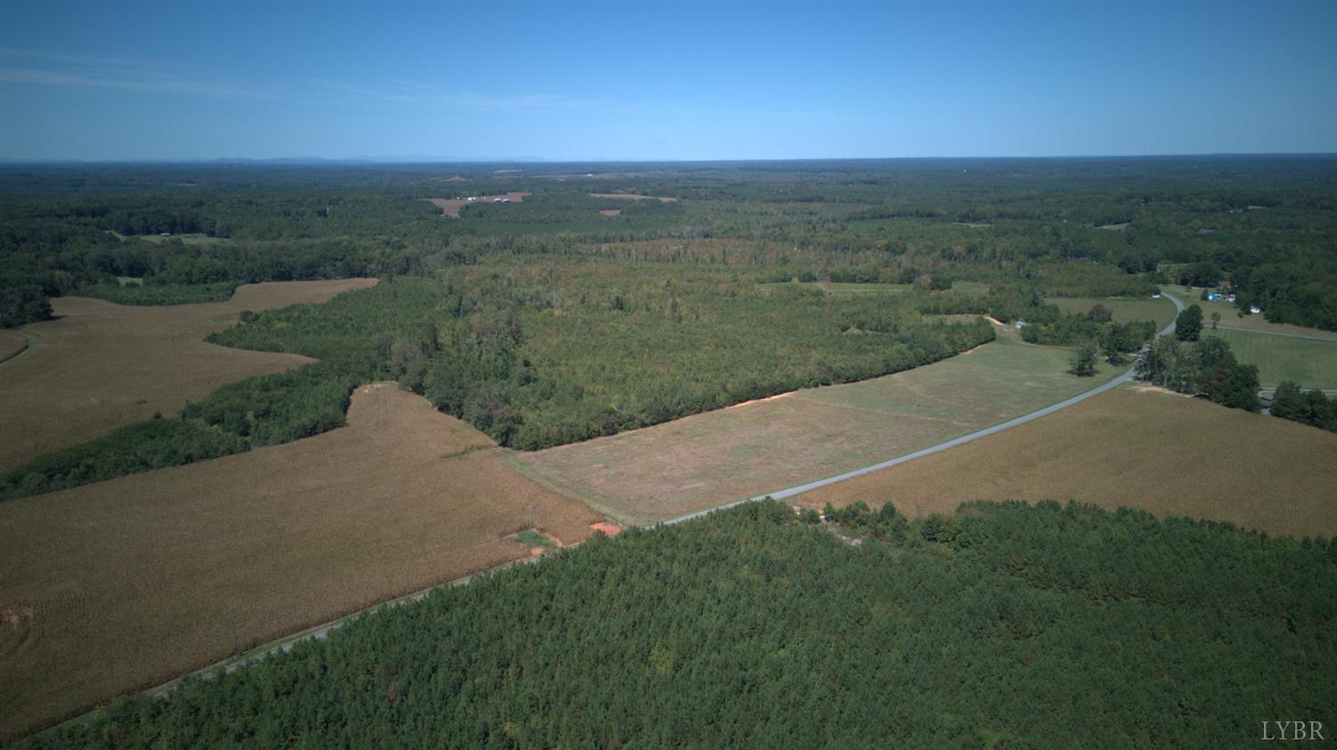 1 Coles Ferry Road Nathalie, VA 24577 - Photo 3 of 8 a view of a field with a yard