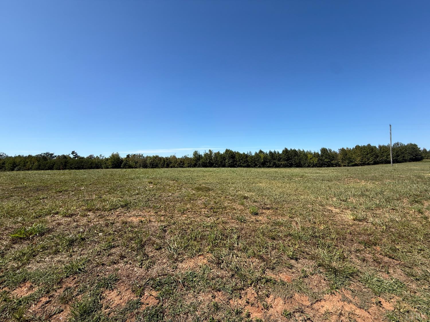 1 Coles Ferry Road Nathalie, VA 24577 - Photo 8 of 8 a view of a lake from a yard