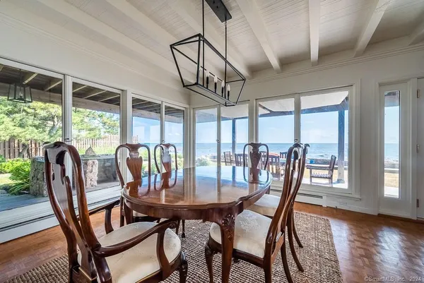 a kitchen with granite countertop cabinets stainless steel appliances a sink and a large window